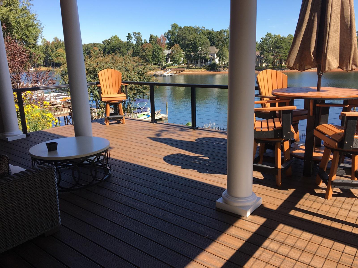 A custom wood deck built onto the back of a Lake Norman home
